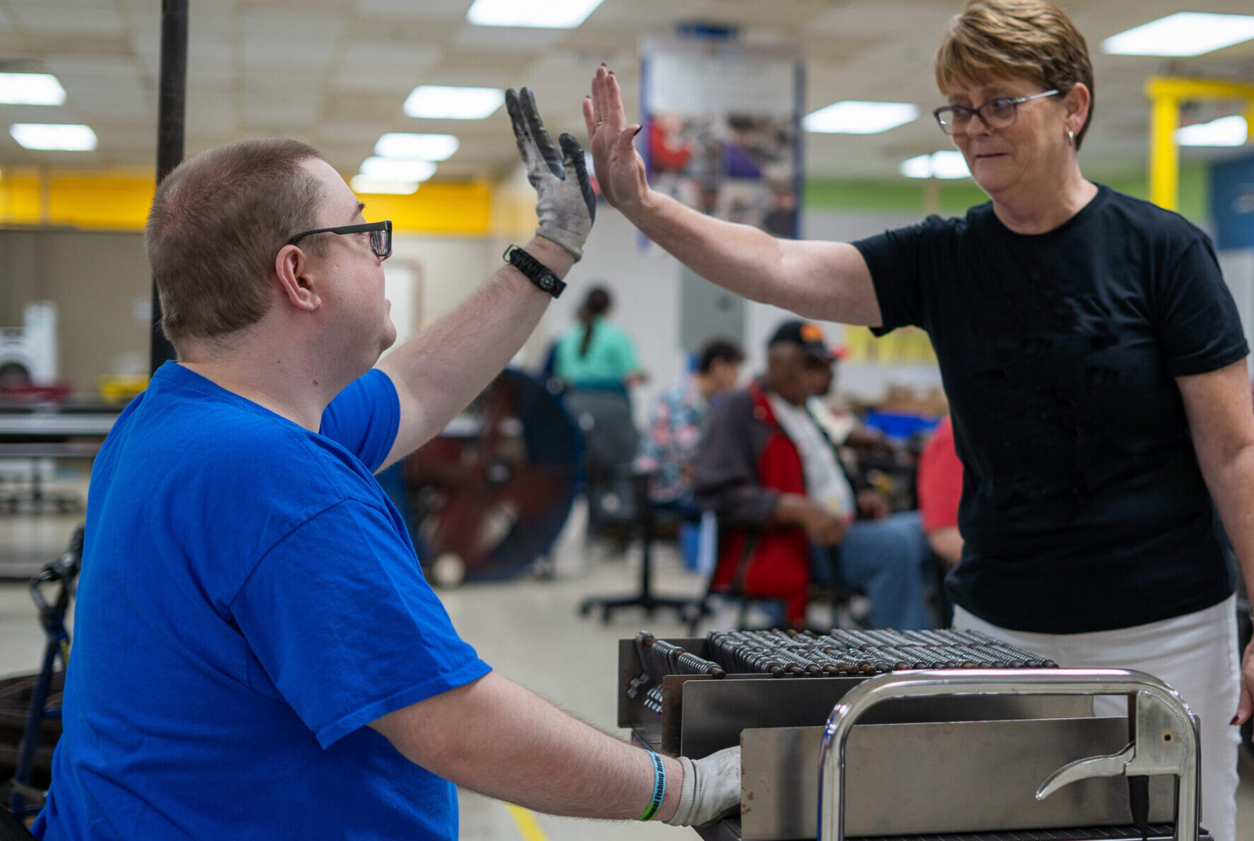 TAC employees high-fiving