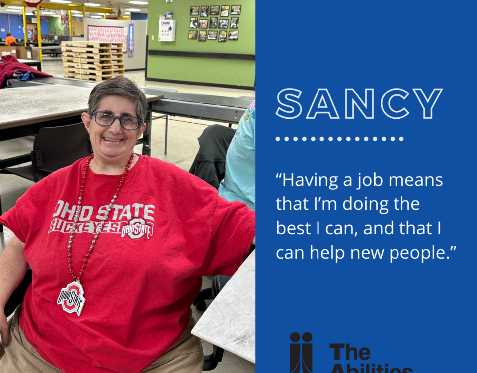 An image of a person (Sancy), wearing a red "Ohio State Buckeyes" shirt and necklace, smiling at the camera, showcasing independence in the workplace. Text displayed is "Sancy" and "Having a job means that I'm doing the best I can, and that I can help new people."